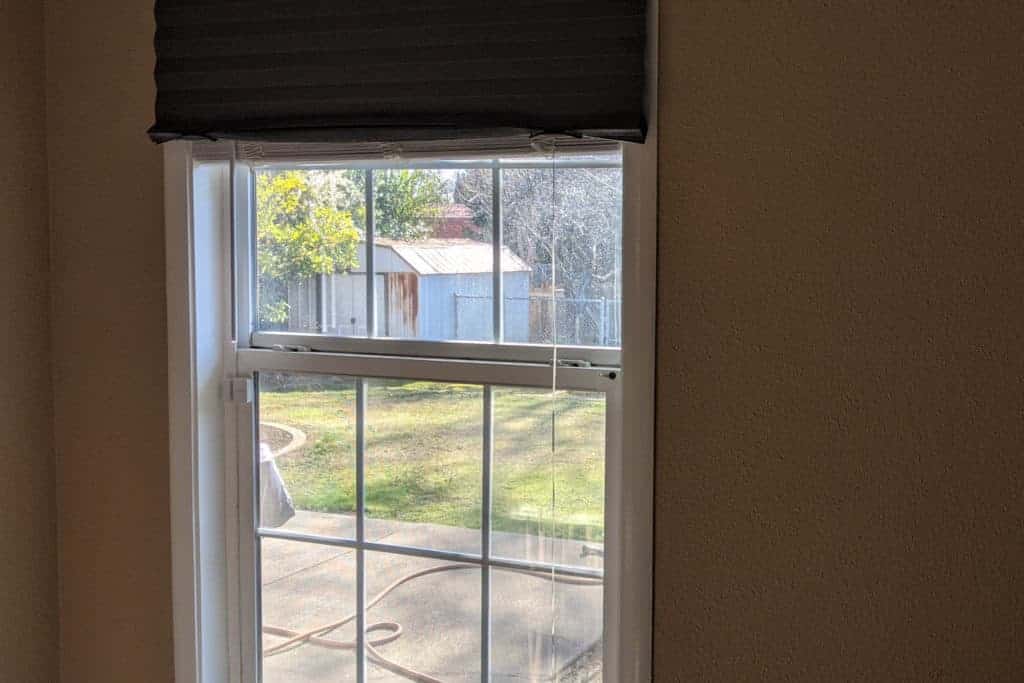 Jump Your Way To Better Vision. Looking out a window at a shed in the distance.