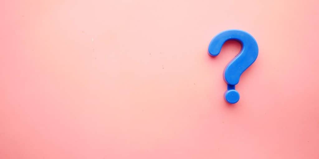 Pink background with a blue question mark to answer the question, why?